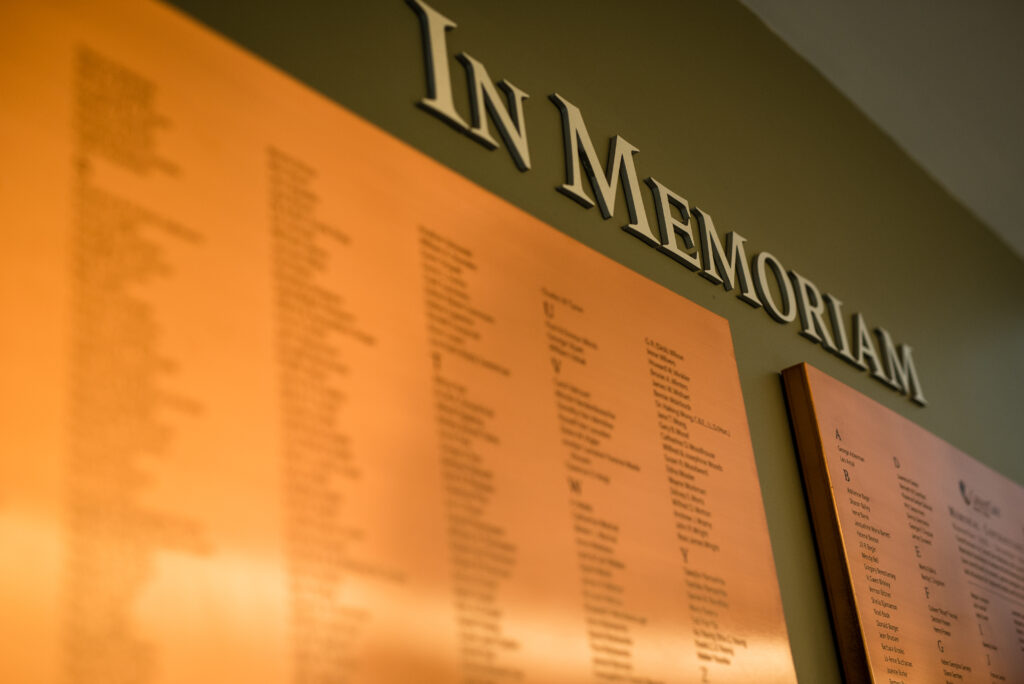 copper memorial plaques with names of those memorialized, engraved.